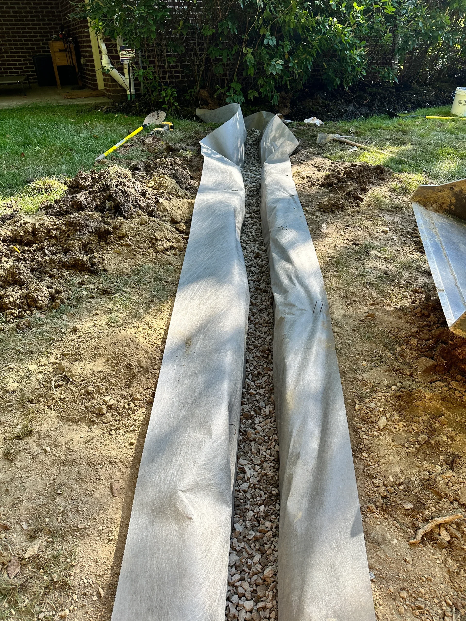 French Drain Installation Rock Base