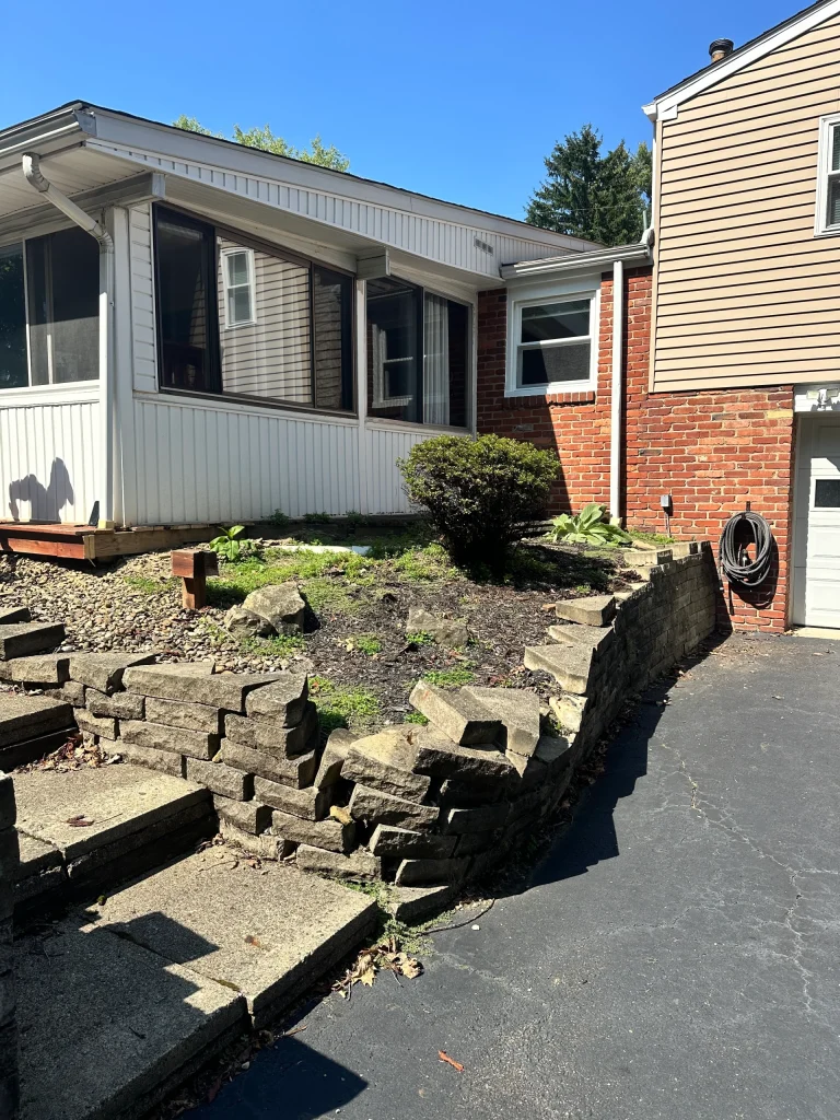Retaining Wall Before Photo Showing Collapsed Rock Wall