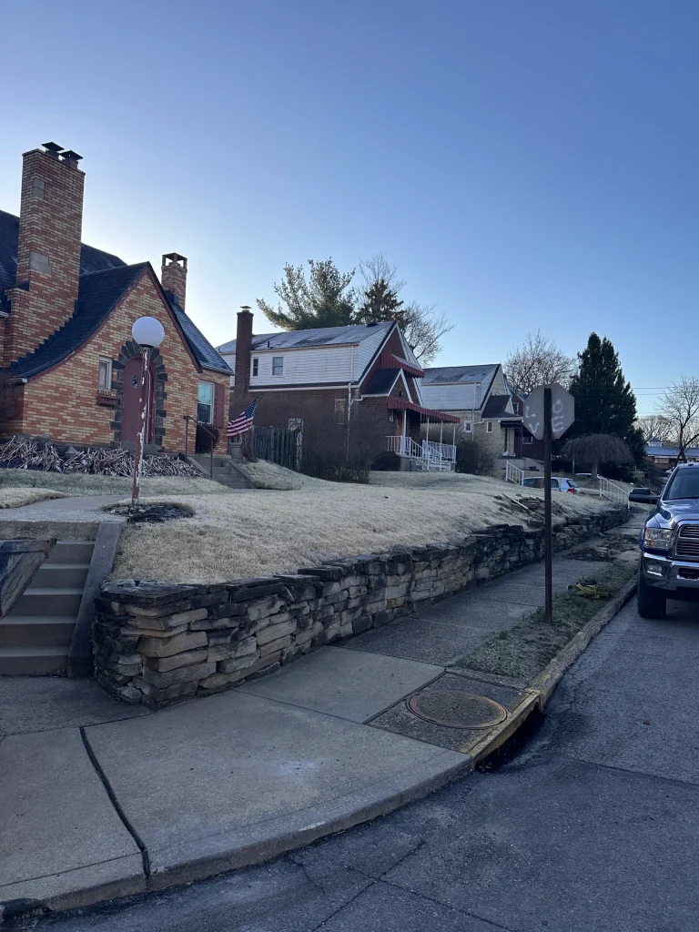 Retaining Wall Before Photo Showing Unstable Rock Wall