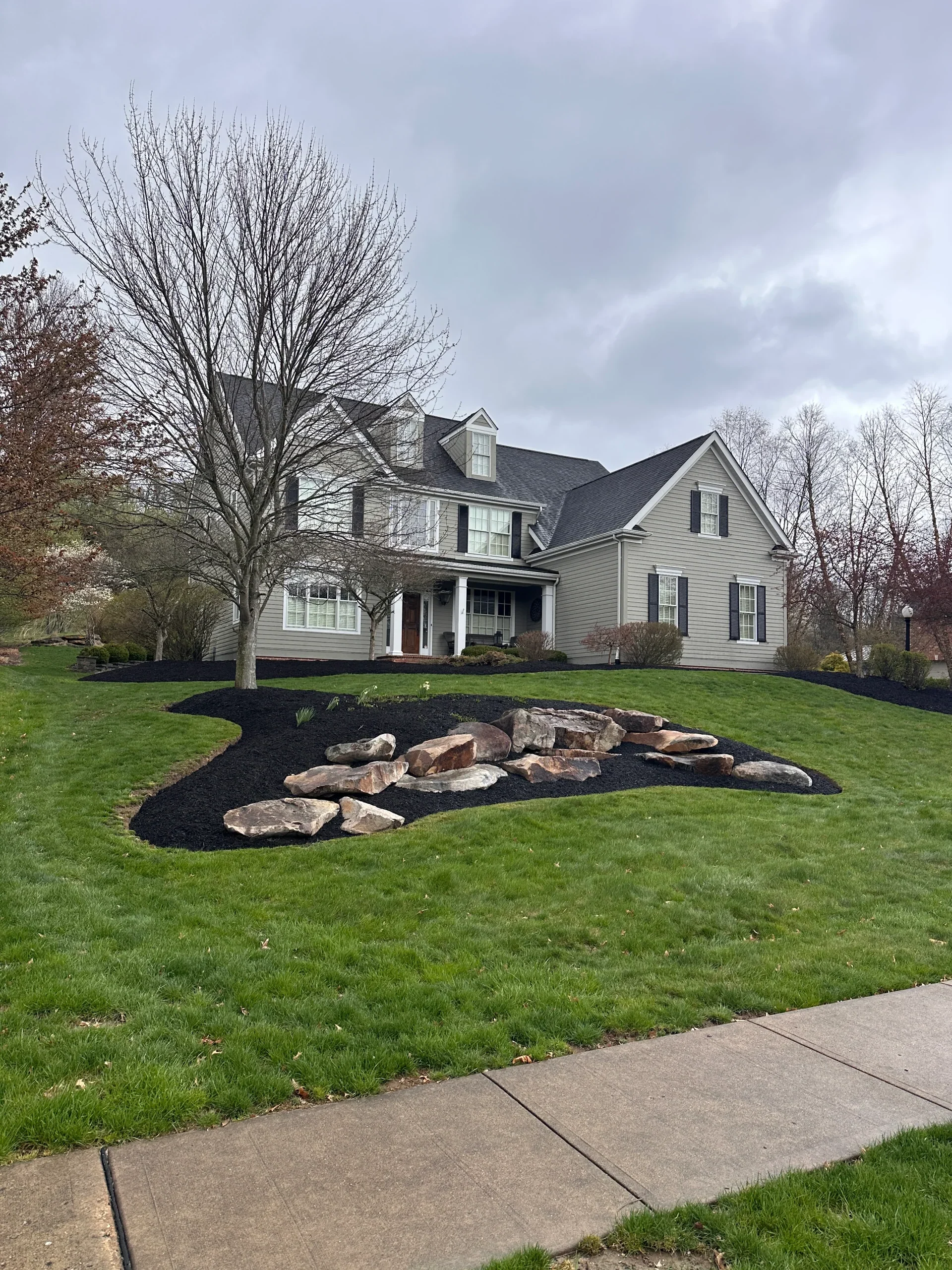 Mulch Bed and Large Rock Installation In Front Yard