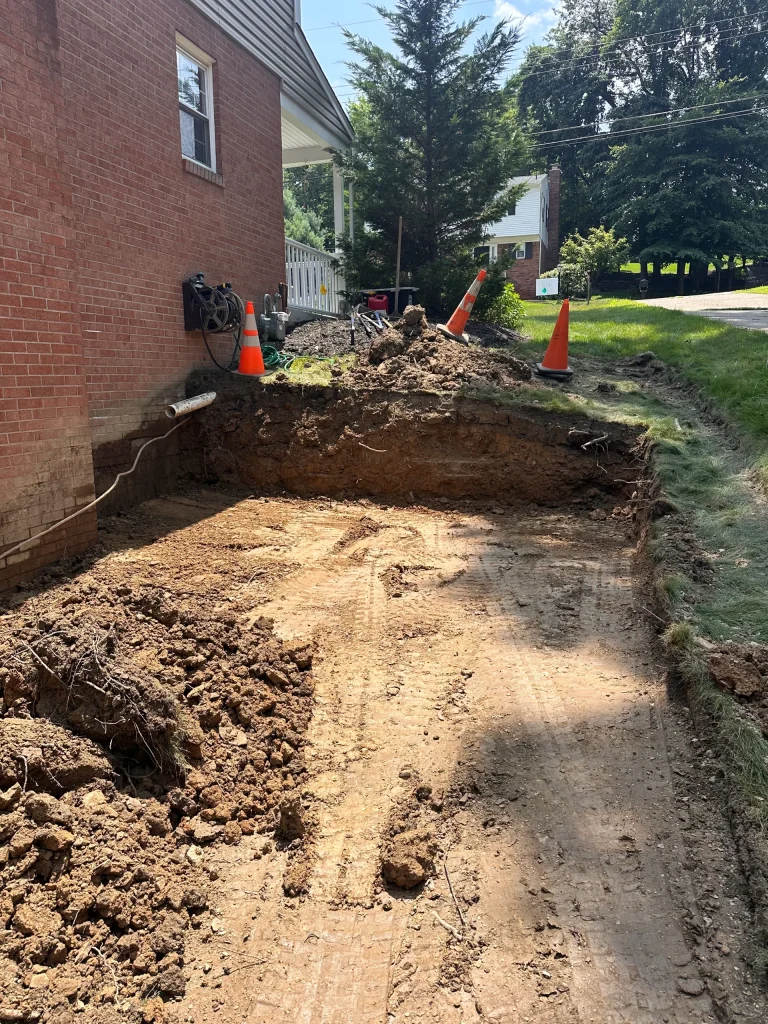 Retaining Wall In Progress Showing Area Dug Out For Wall Placement
